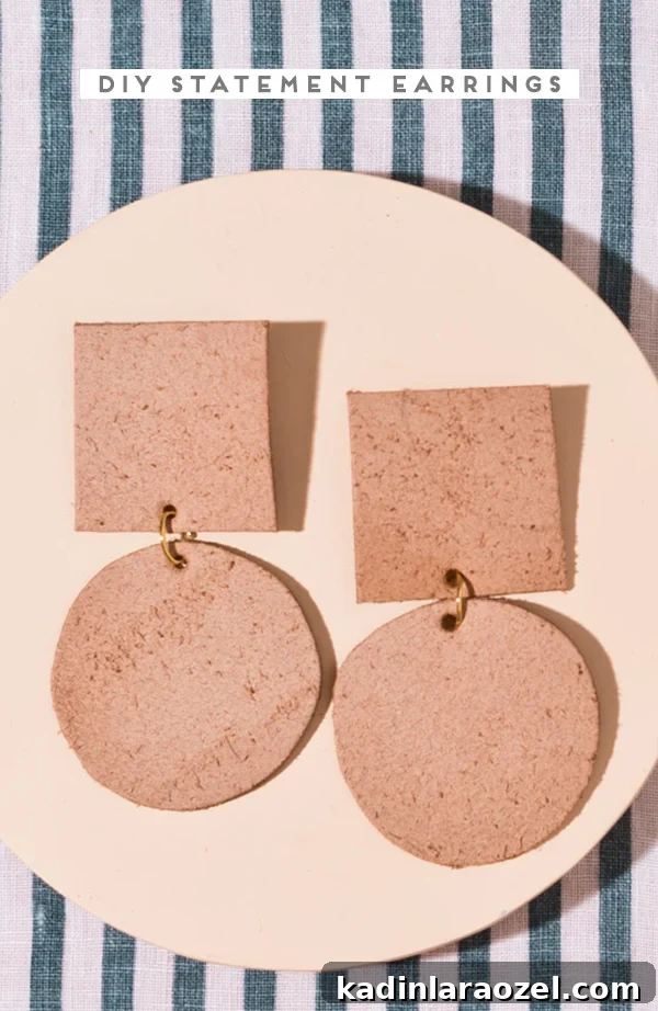 How to Make Bold Leather Statement Earrings: A Step-by-Step Guide 5 Geometric leather earrings with squares and circles on a striped cloth