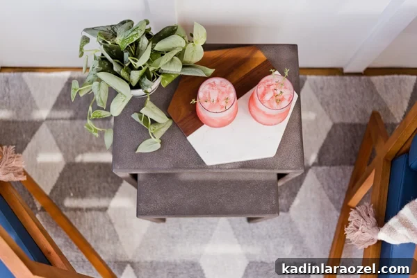 This small outdoor space that went from completely bare to cozy modern with just a few items. #frontporchreveal #outdoorreveal #outdoormakeover #frontporchmakeover #beforeafterhome #porchmakeover