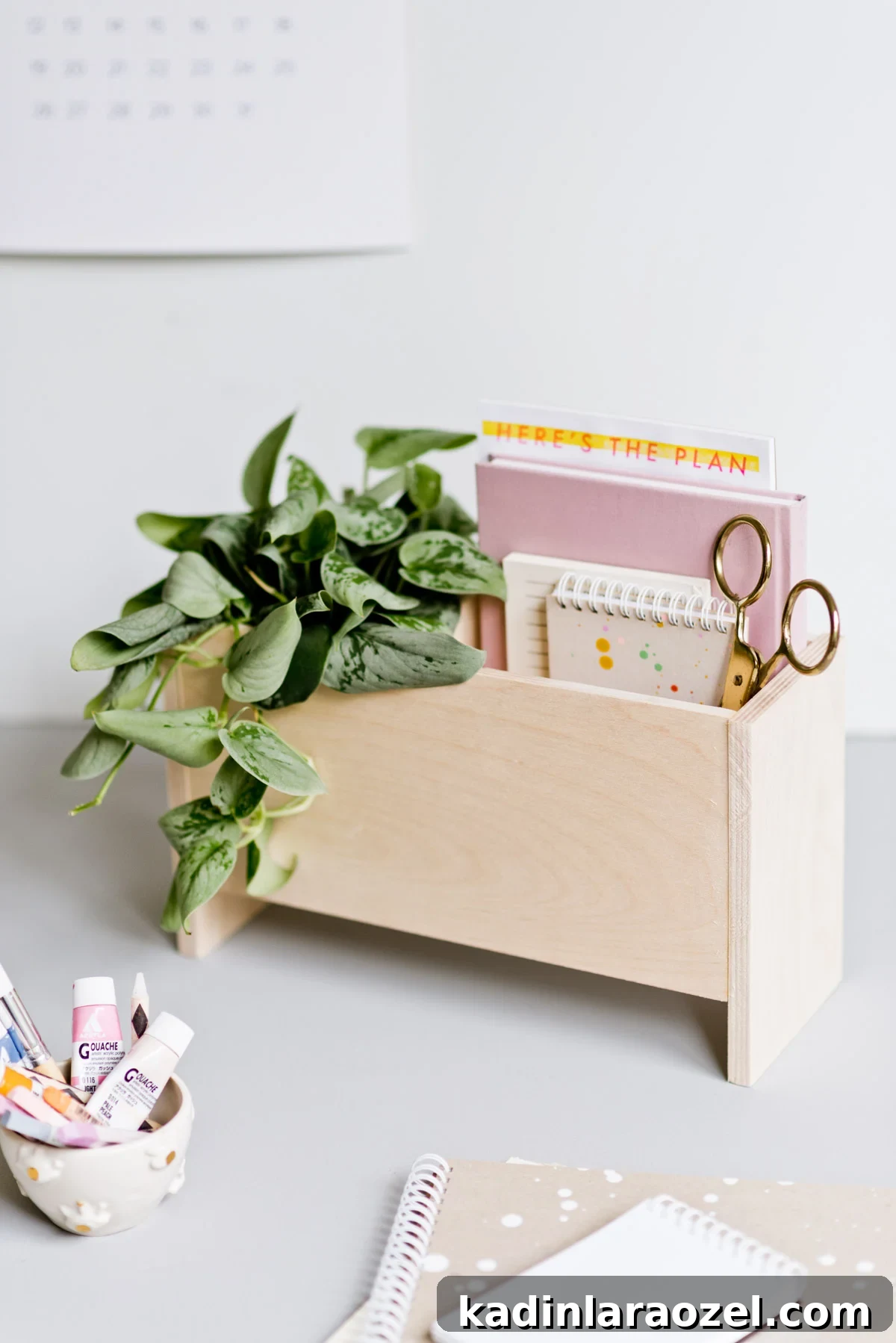 DIY Wooden Desk Organizer: Step-by-Step Build Guide 6 minimal modern desk space with wooden caddy and planter, calendar hanging on the wall