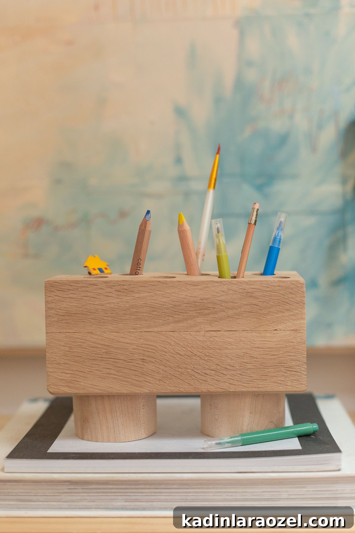 minimal wood pencil holder sitting on artful desk