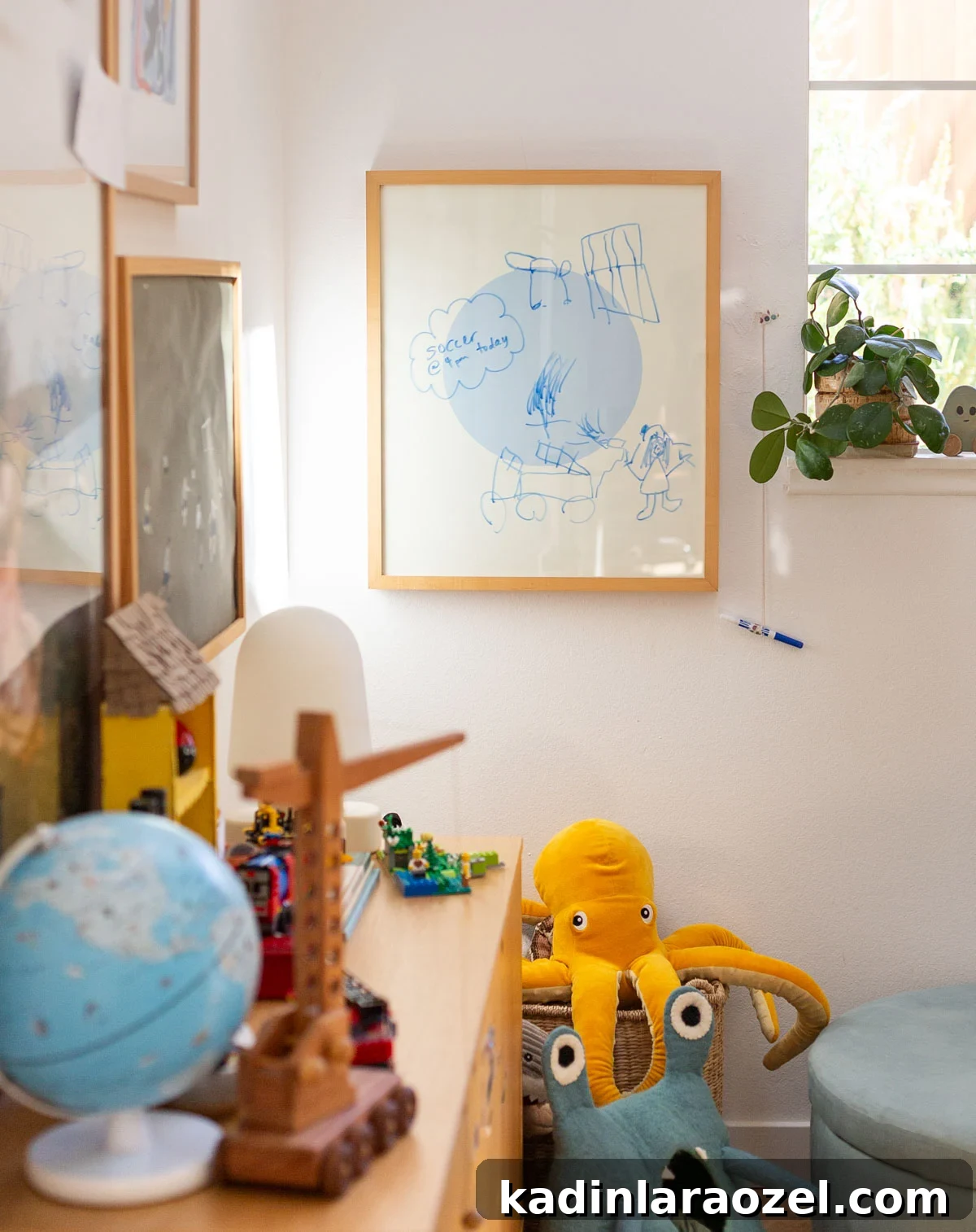 kids room with modern artwork and colorful stuffed animals