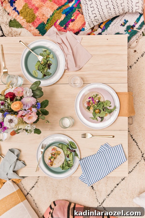 How to throw the perfect end of summer get-together. Click through for entertaining tips from Brittni Mehlhoff of Paper and Stitch. #summerentertaining #entertainingideas #entertainingtips #dinnerparty #outdoorentertaining #overheadtable #outdoorpicnic