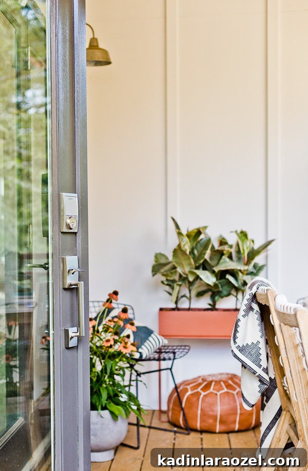 12 Back Porch Makeovers: Progress Over 12 Months 11 A small(ish) back porch gets a makeover, from completely empty to comfortable and stylish - Paper and Stitch. #porchmakeover #outdoorinspiration #modernoutdoorliving #organicmodernliving #outdoormakeover #outdoorentertaining
