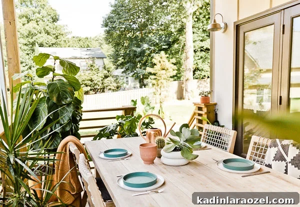 12 Back Porch Makeovers: Progress Over 12 Months 12 A small(ish) back porch gets a makeover, from completely empty to comfortable and stylish - Paper and Stitch. #porchmakeover #outdoorinspiration #modernoutdoorliving #organicmodernliving #outdoormakeover #outdoorentertaining