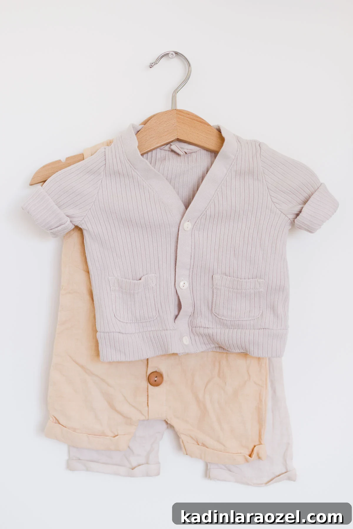 Natural Fabric Dyeing: How to Dye Clothes with Plant-Based Colors 7 Neutral and muted color baby clothes hanging on wooden hanger