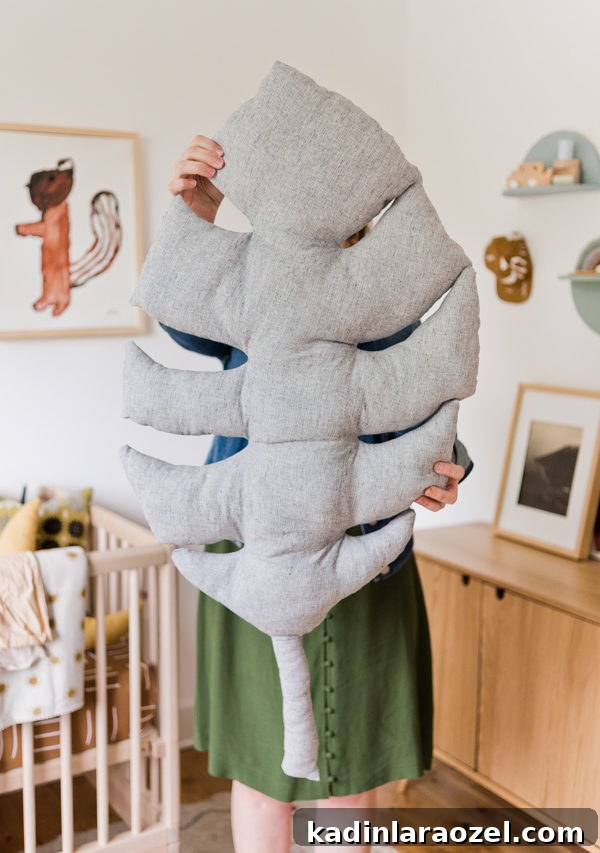 Giant Monstera Leaf Pillow Pattern (Plus Small Version) 5 DIY Pillow Idea: Click through to learn how to make a giant monstera leaf pillow (and a smaller size too). #diypillow #leafpillow #diyhome #diyhomedecor #nurseryinspiration #kidsroom