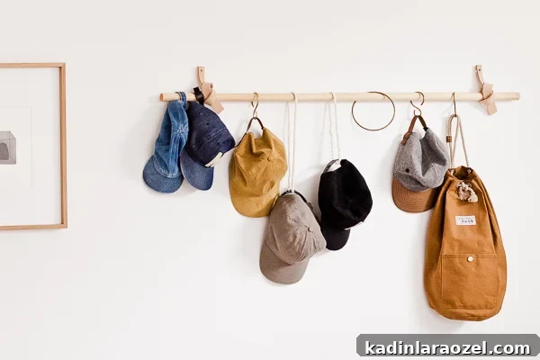 Wood and leather hanging wall organizer for hats and bags