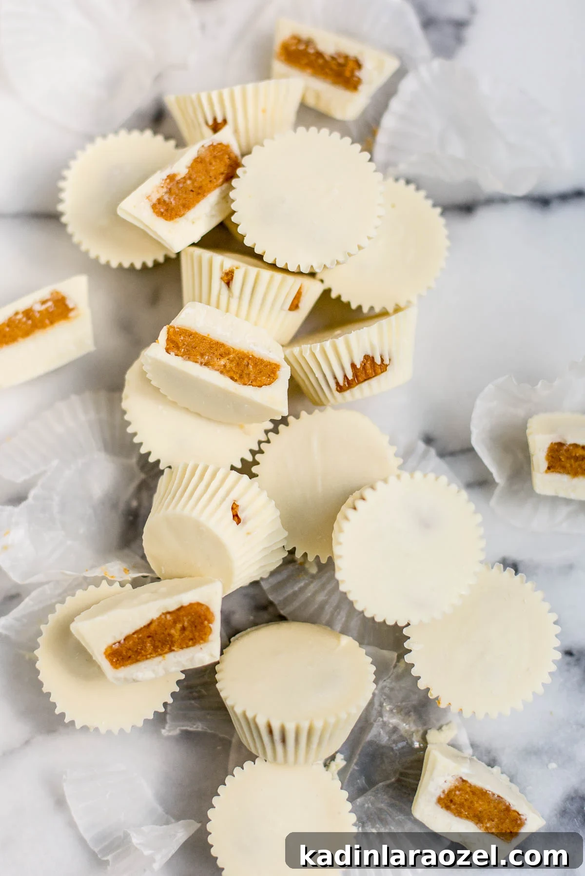 white chocolate candy cups with pumpkin pie filling inside
