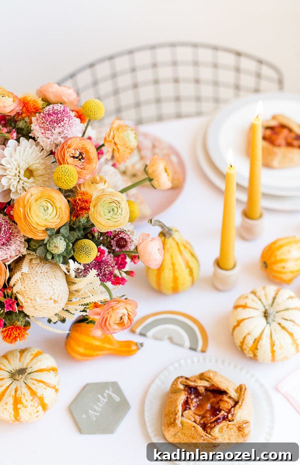 Cozy Colorful Modern Thanksgiving Tablescape Ideas 10 A unique Thanksgiving tablescape that is minimal and modern, but still cozy and colorful. Complete with beeswax candles, hand stamped linens, DIY florals, and more. #thanksgiving #tablescape #tabledecor #entertainingideas #thanksgivingentertaining #thanksgivingdiy