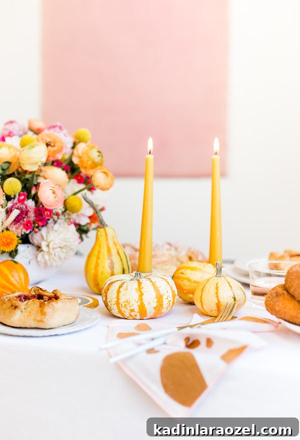 Cozy Colorful Modern Thanksgiving Tablescape Ideas 6 A unique Thanksgiving tablescape that is minimal and modern, but still cozy and colorful. Complete with beeswax candles, hand stamped linens, DIY florals, and more. #thanksgiving #tablescape #tabledecor #entertainingideas #thanksgivingentertaining #thanksgivingdiy