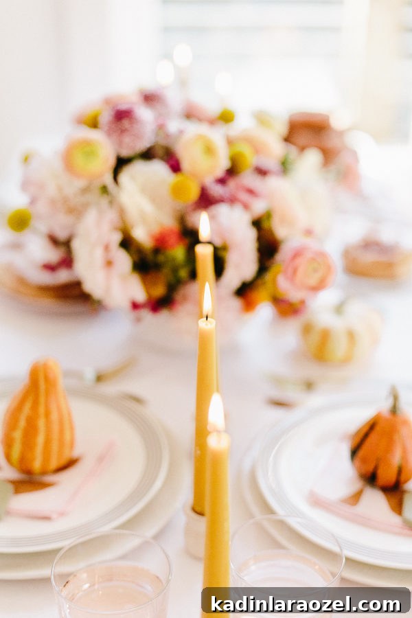 Cozy Colorful Modern Thanksgiving Tablescape Ideas 9 A unique Thanksgiving tablescape that is minimal and modern, but still cozy and colorful. Complete with beeswax candles, hand stamped linens, DIY florals, and more. #thanksgiving #tablescape #tabledecor #entertainingideas #thanksgivingentertaining #thanksgivingdiy