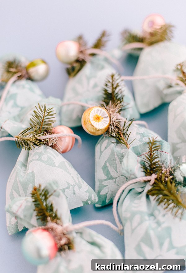 DIY Holiday Fabric Gift Wrap: Stylish Eco-Friendly Ideas 10 Looking for a unique DIY gift wrap idea for the holidays? Check out this tutorial for DIY fabric gift wrap you can customize for everyone on your gift list. #holidays #giftwrap #diyholidays #diy #stenciling #christmas #christmasdiy
