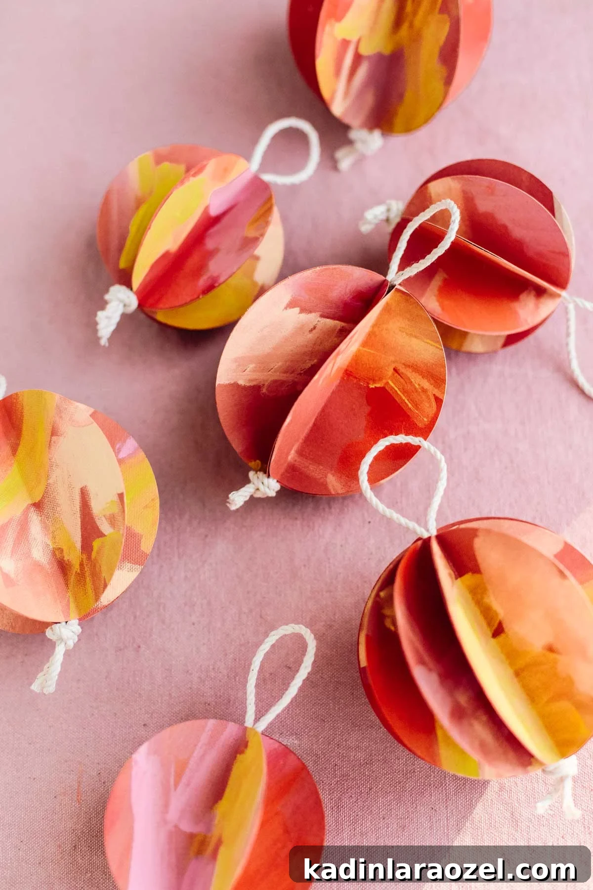 paper balls in red, yellow, and orange for the holidays