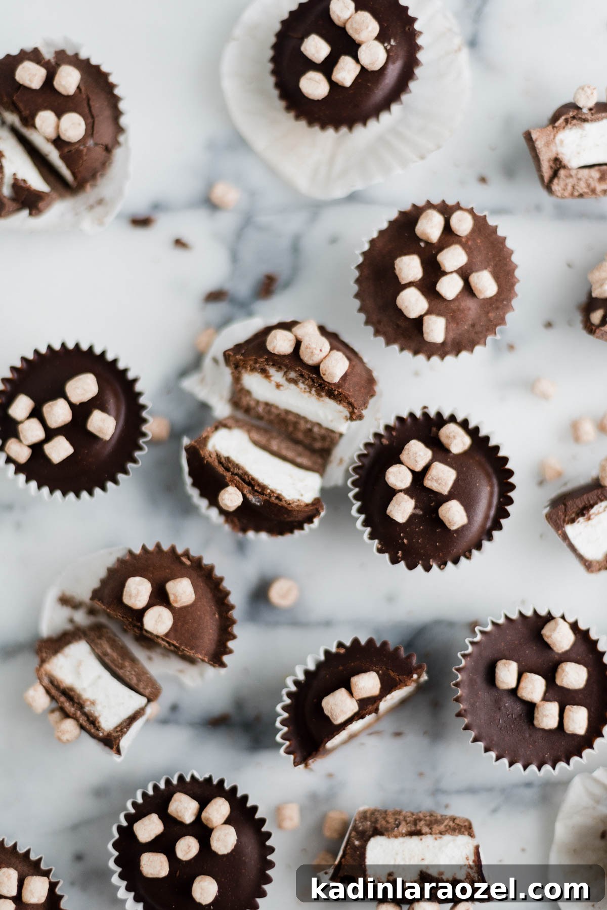 closeup of hot cocoa candy cups on a marble countertop