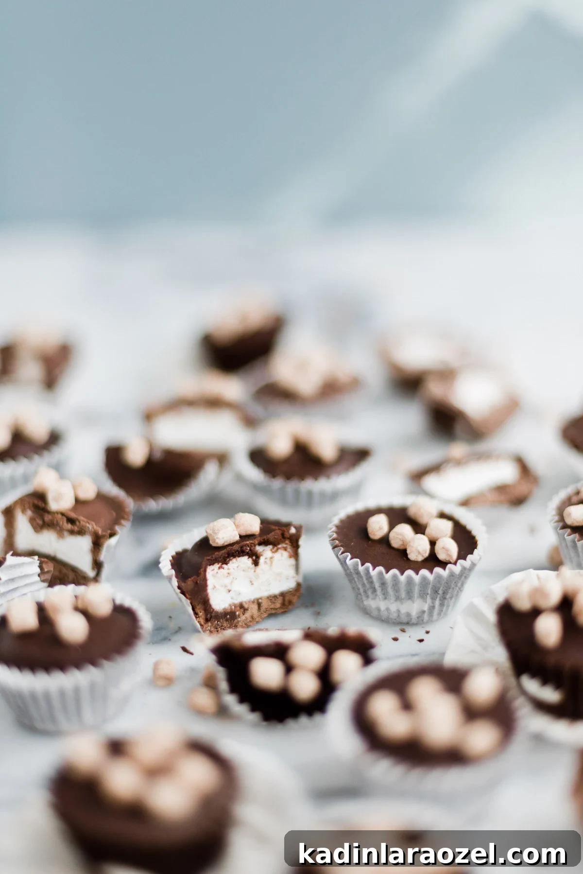 cut up homemade candy cups with marshmallow in the inside