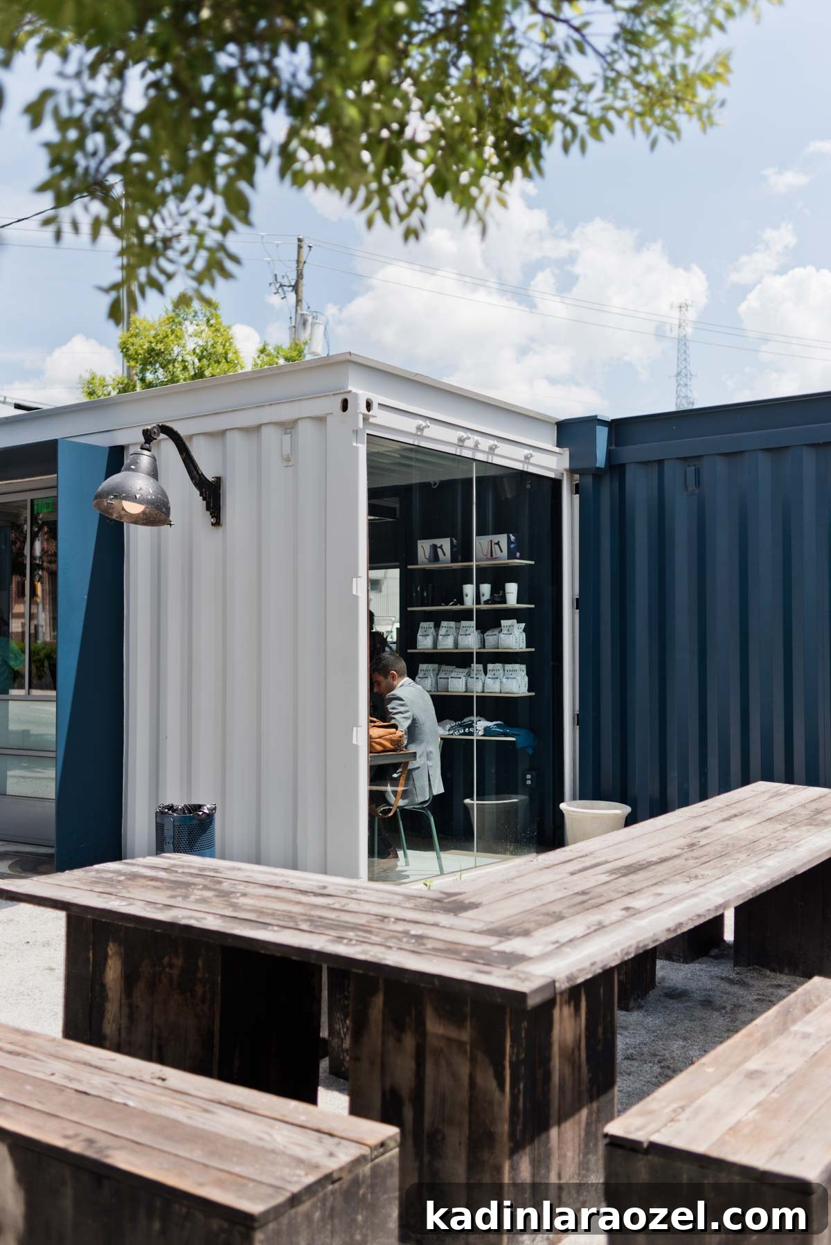 Coffee shop in Atlanta, GA made of old shipping containers with wood tables outdoors