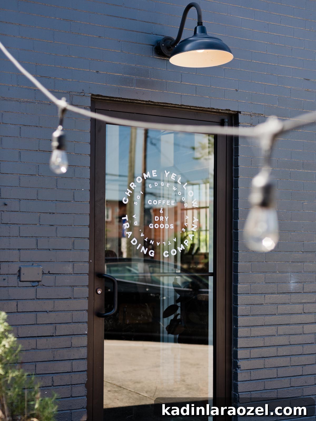 exterior of coffee shop called Chrome Yellow in Atlanta, painted black brick building