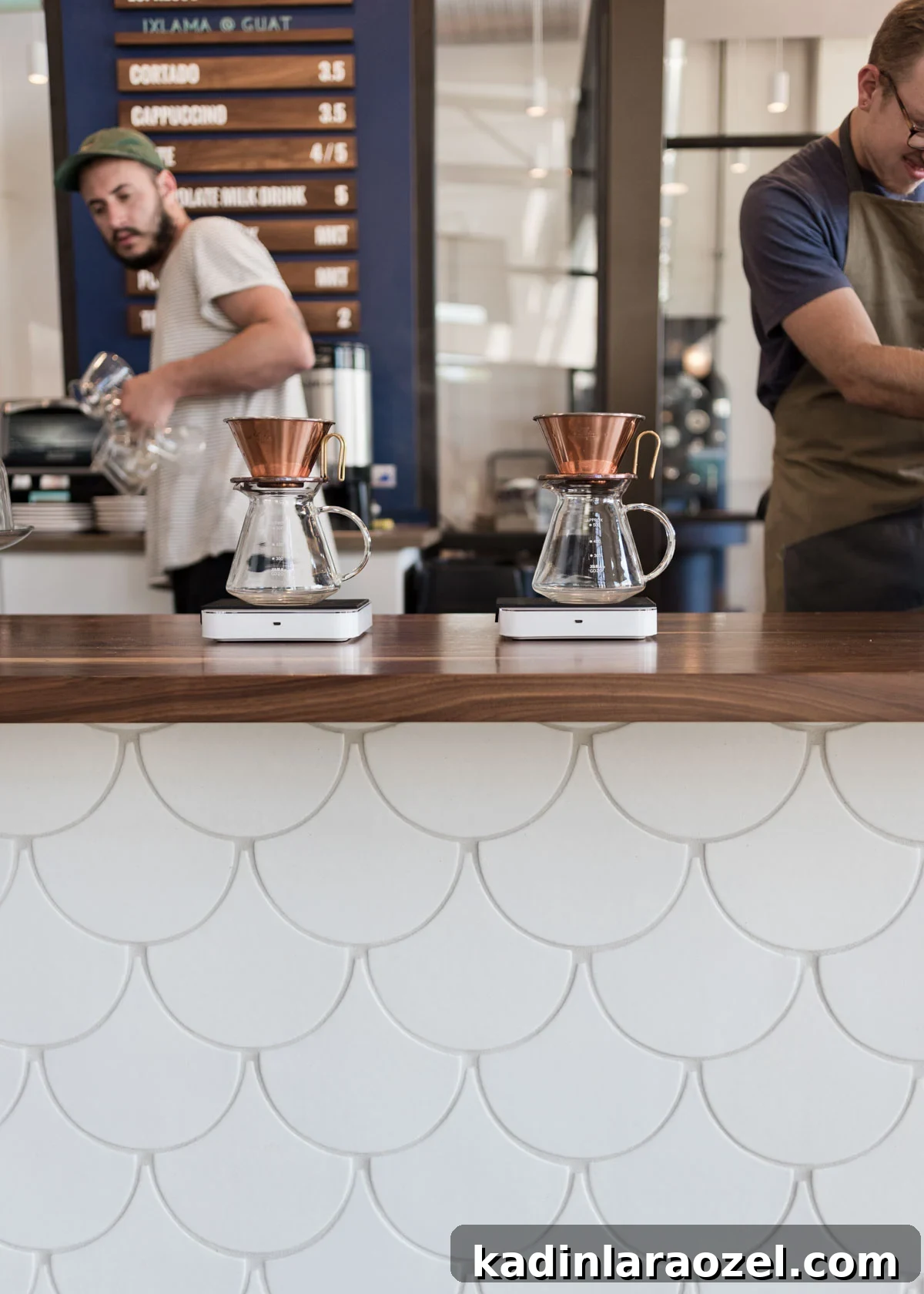 interior of a coffee shop with minimal modern style - white tile and wood countertops