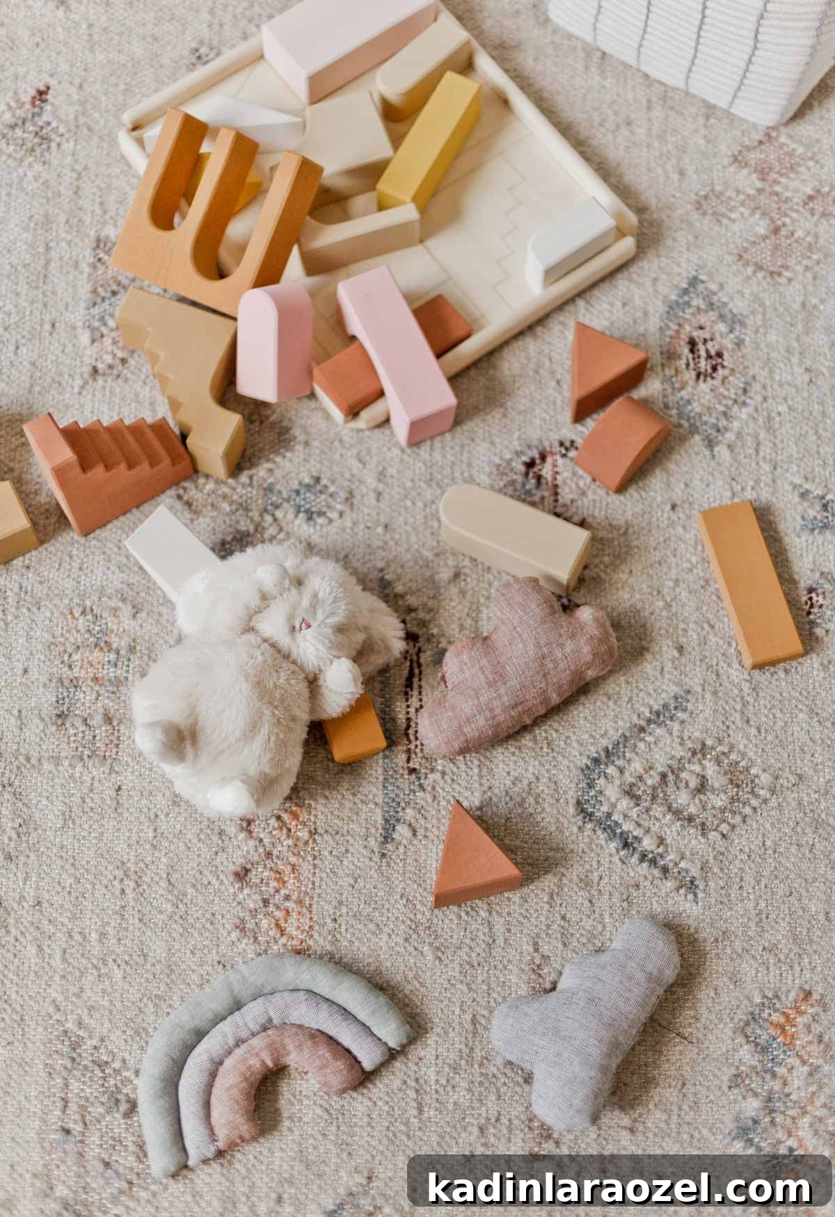 Make Adorable Plush Toys for Kids: Step-by-Step Sewing Guide 10 toddler's neutral toys laid out on floor to play with