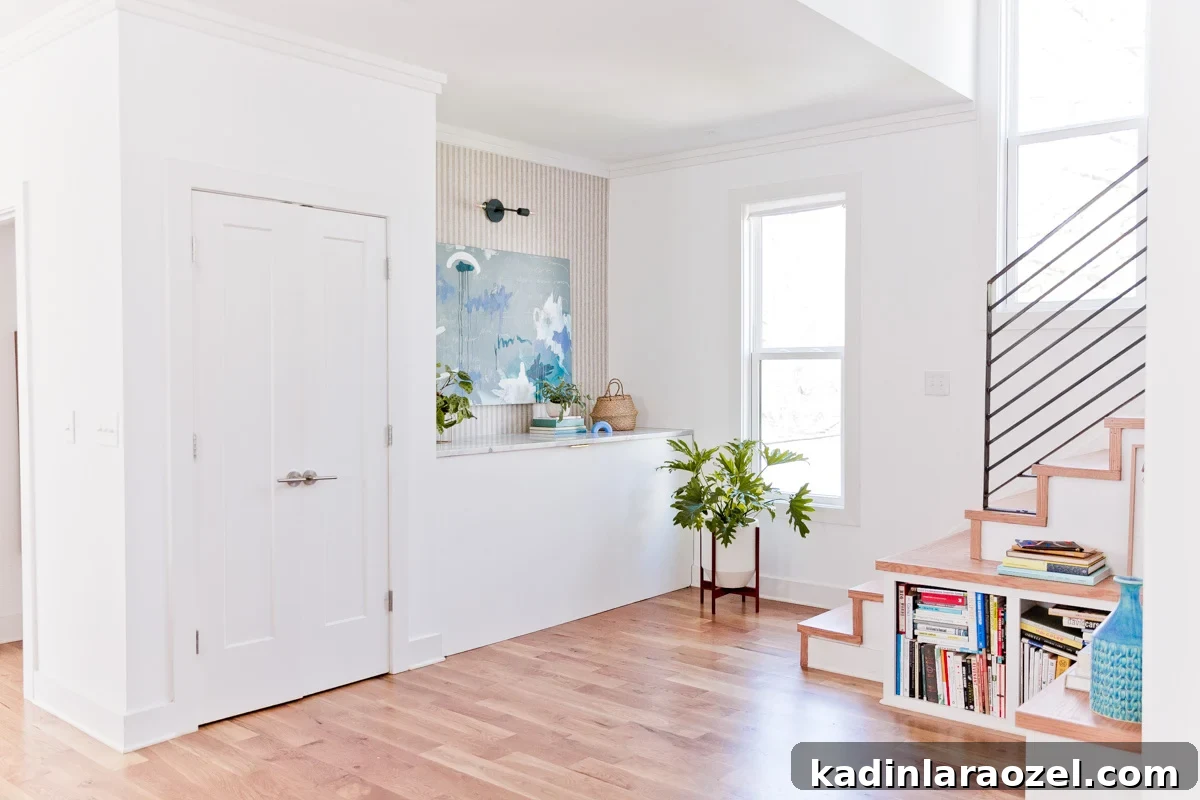 From Farmhouse Drab to Modern Chic: Transforming an Awkward Landing for Under $450 8 modern landing area with minimal wood staircase