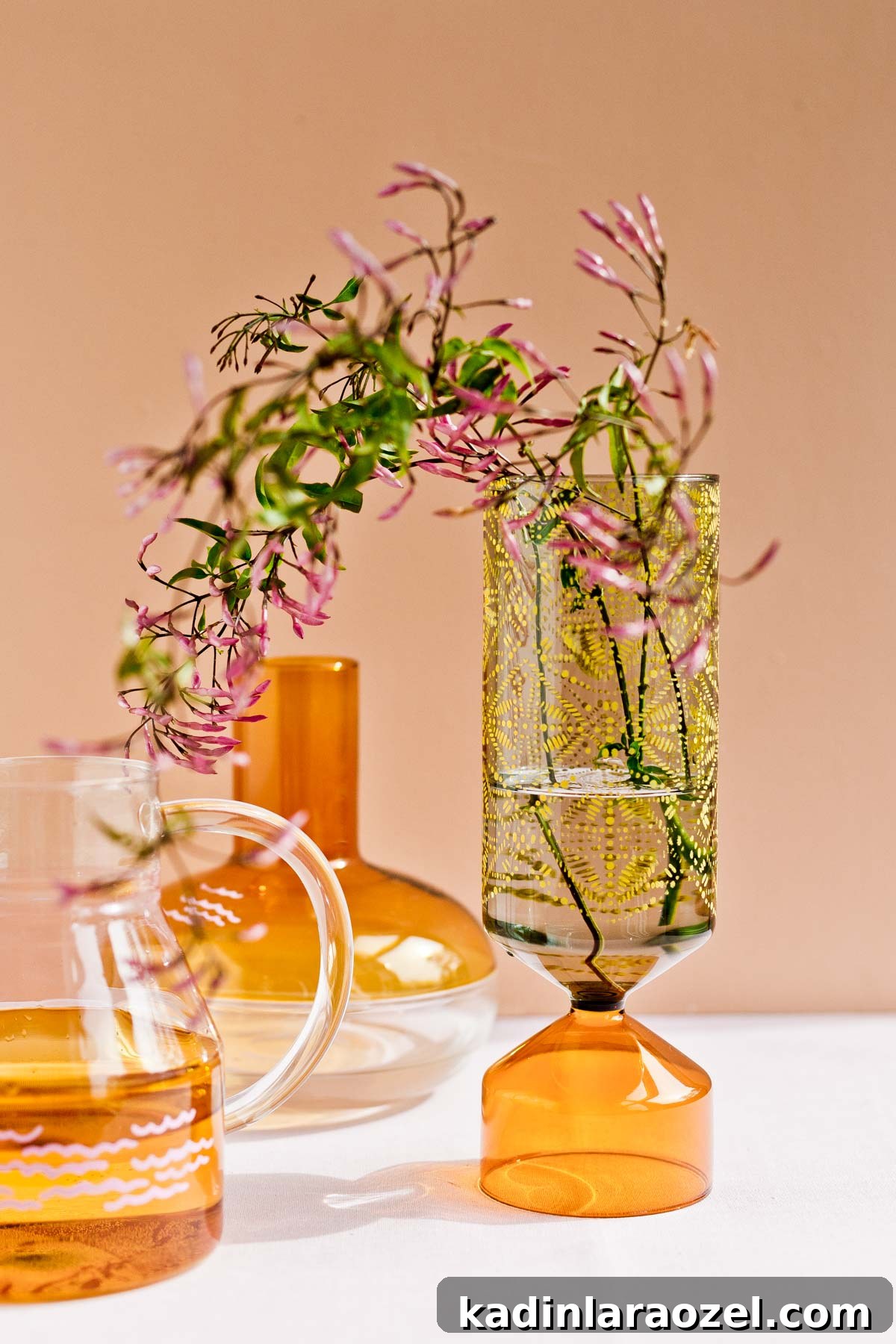 Color blocked glass vases with stenciled pattern and wispy bouquet