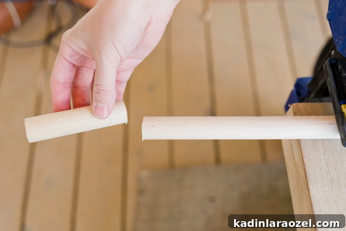 Transform Your Ikea Moppe Mini Chest with a Modern Minimal Hack 5 Cutting dowel rod to make DIY drawer pulls out of wood and leather.