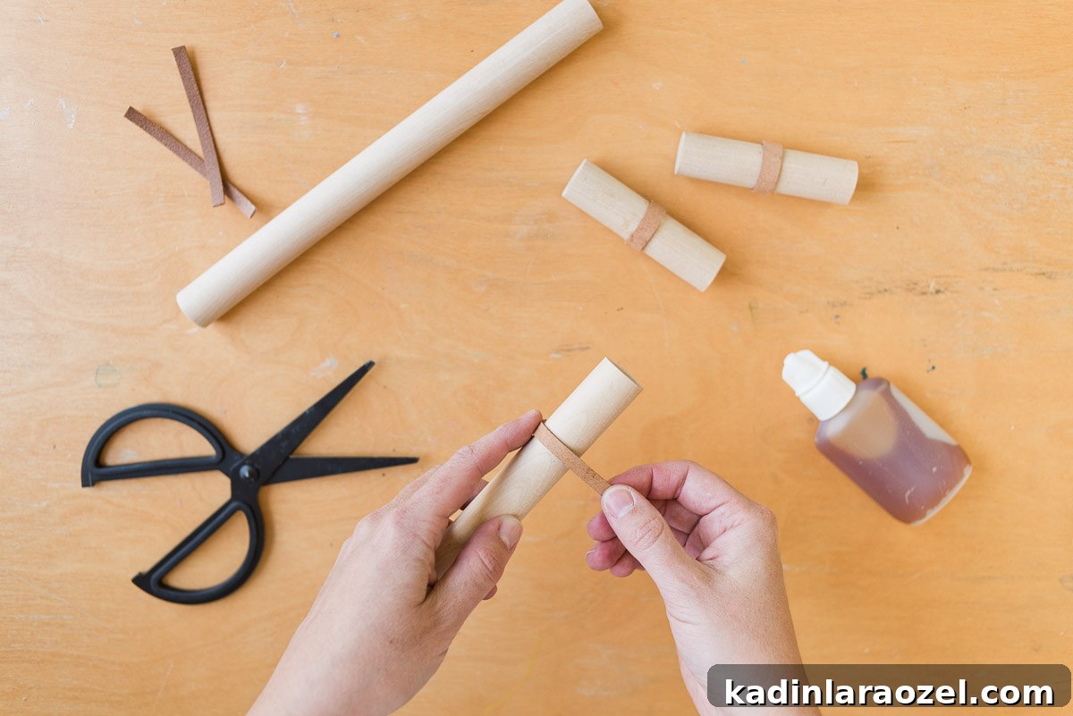 Transform Your Ikea Moppe Mini Chest with a Modern Minimal Hack 7 Wrapping leather around wood dowel rods for DIY drawer pulls.