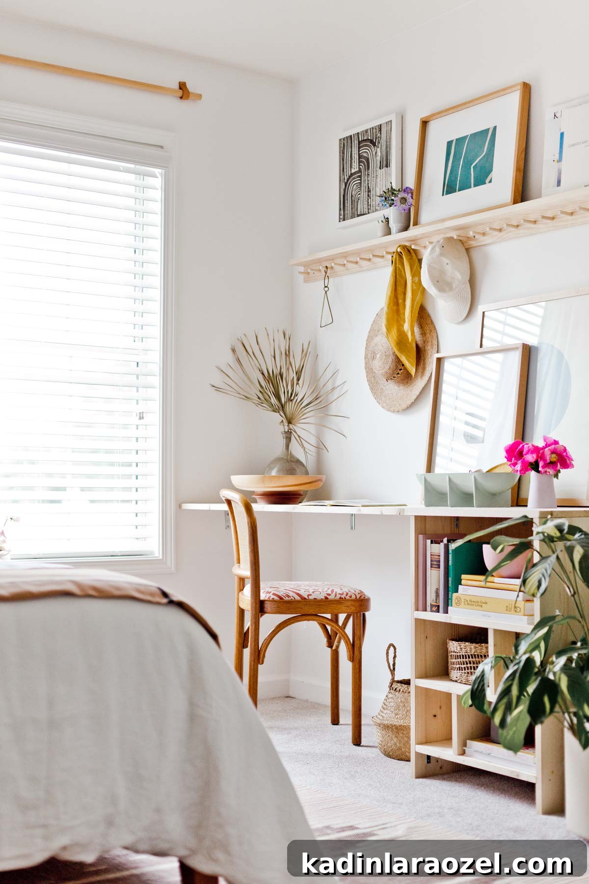 Built in desk and open shelves in a minimal modern bedroom with neutral decor