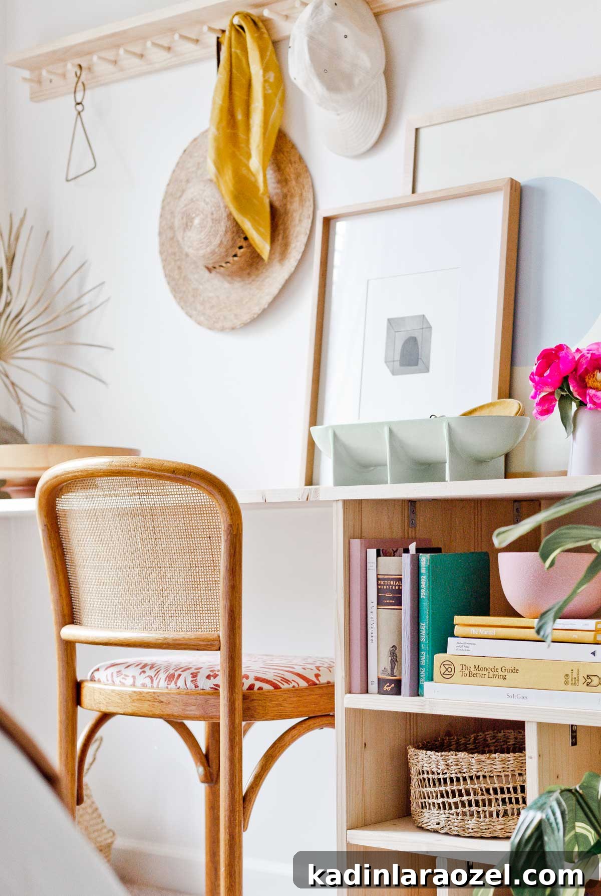 Built in wood desk with open shelving and a wooden peg rail above on the wall