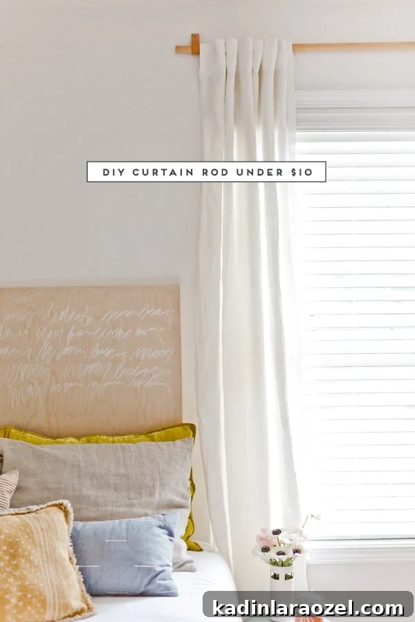 DIY Curtain Rods for Under $10: A Step-by-Step Guide 3 neutral, modern bedroom with wood and leather curtain rod and white curtains