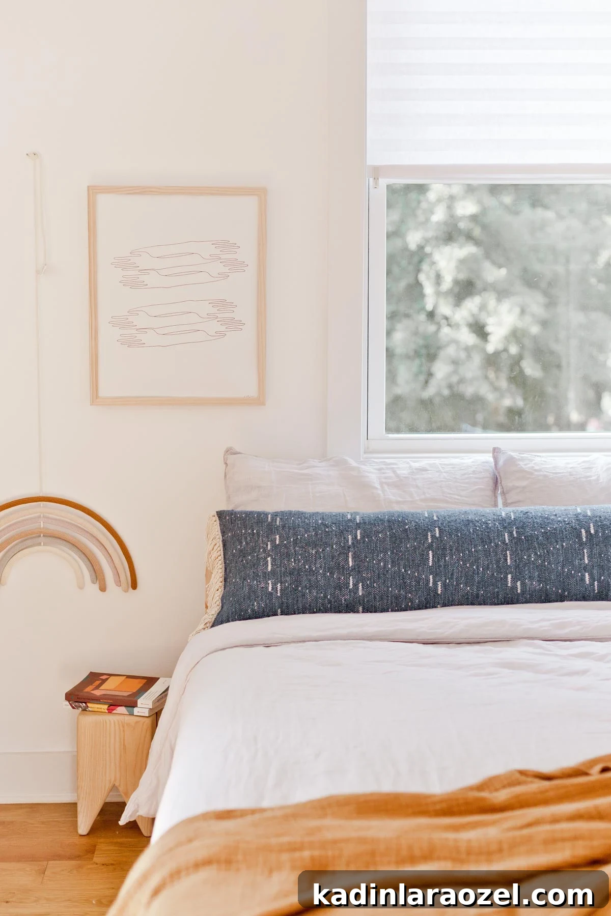 How to Sew an Extra-Long Lumbar Pillow for Sofa and Bed 10 Light-filled bedroom with linen bedding and a blue extra long lumbar pillow.