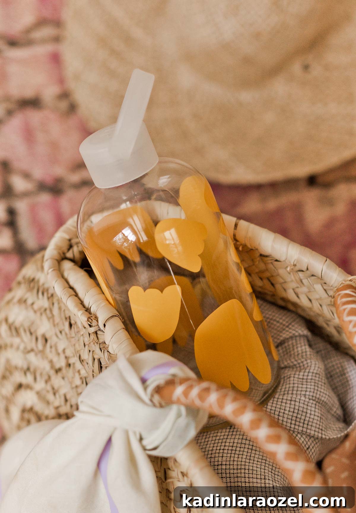 Transforming Closet Finds into Unique DIY Summer Accessories 11 Adding vinyl cut outs to an old water bottle to stay motivated to drink water throughout the summer. Click through for the DIY (tutorial). #diy #vinylstickers #cricutmaker