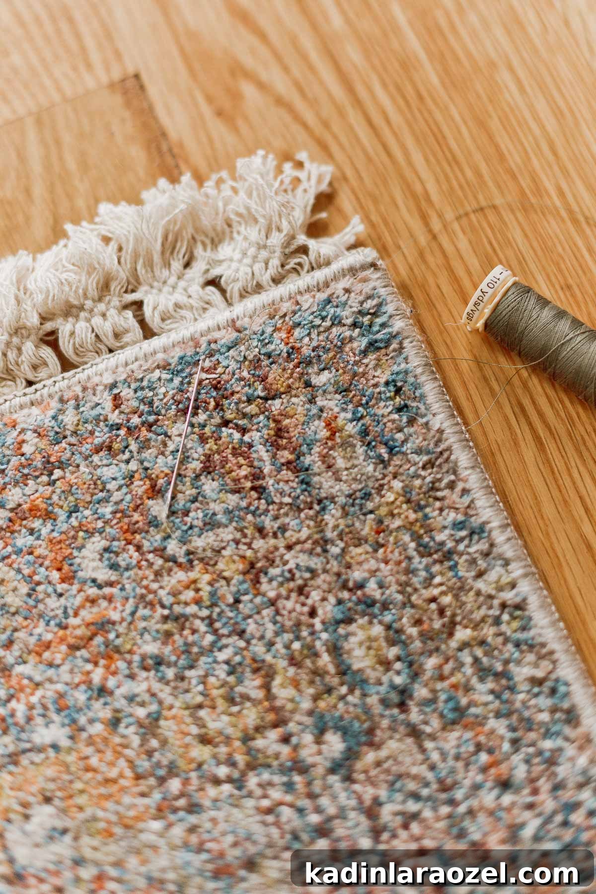 Rug Thug: Upgrade a Cheap Rug for $10 in Under 10 Minutes 6 closeup of sewing rug fringe on with a needle and thread