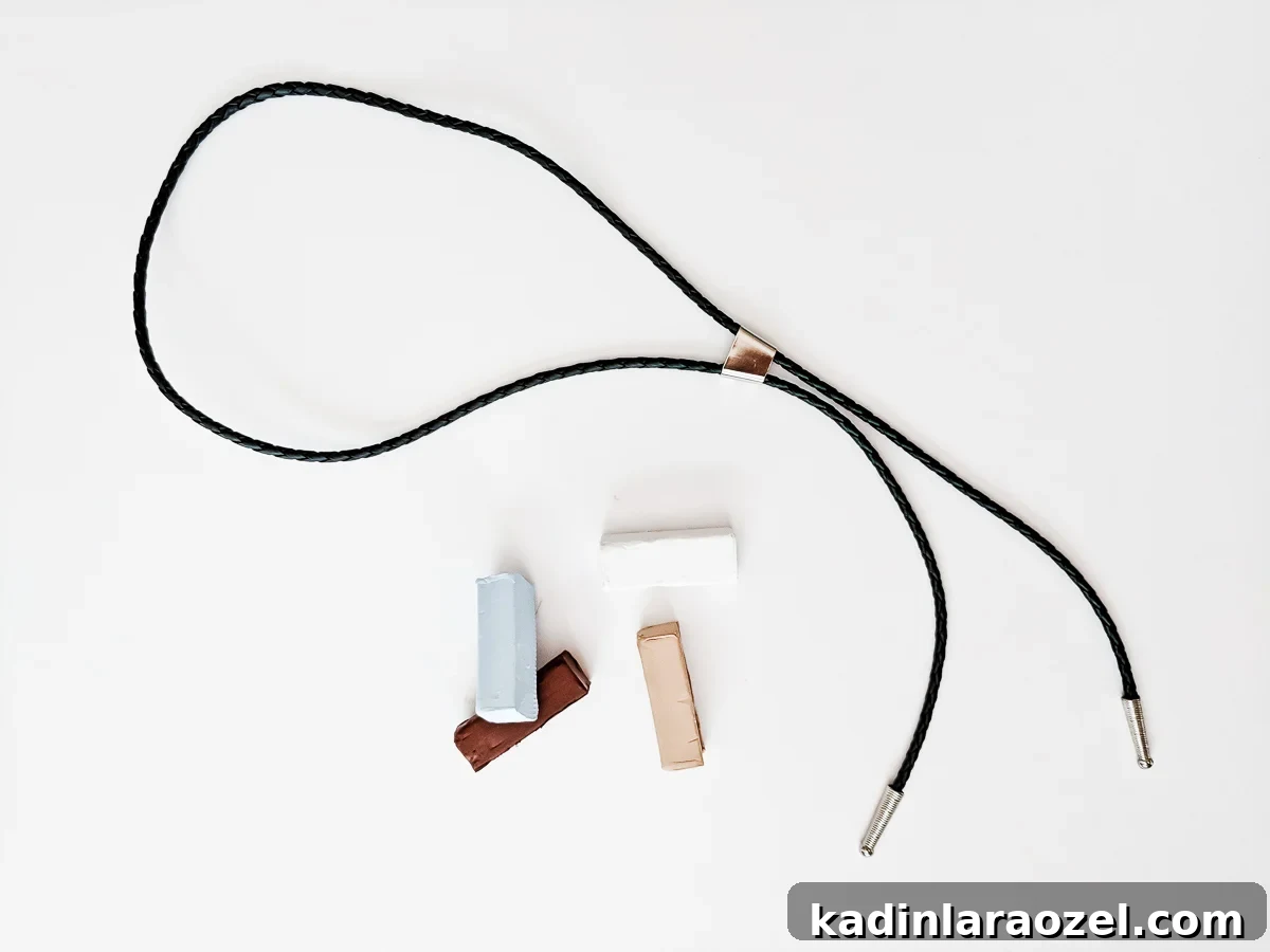 Materials needed to make a DIY rainbow bolo tie.