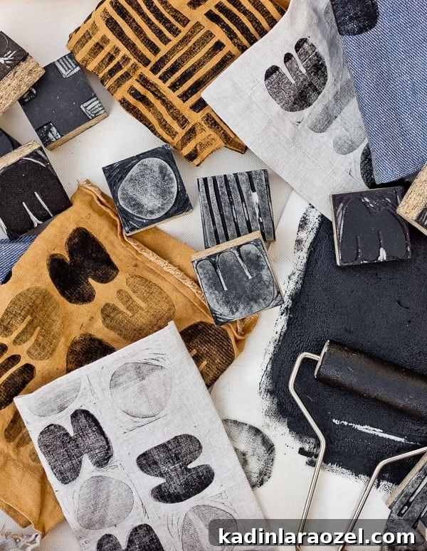 Block Printing Basics: A Step-by-Step Guide to Printing Fabric 2 Carved linoleum blocks and printed fabric shown overhead on a desk.