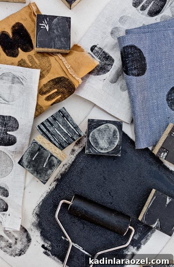 Block Printing Basics: A Step-by-Step Guide to Printing Fabric 13 Carved linoleum blocks and black ink rolled out with a brayer - in process of block printing on fabric.