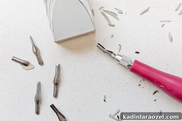 Block Printing Basics: A Step-by-Step Guide to Printing Fabric 6 Carving a linoleum block with block printing carving tool.