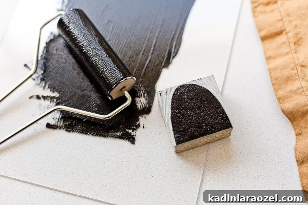 Block Printing Basics: A Step-by-Step Guide to Printing Fabric 8 Inking linoleum block to print onto fabric.