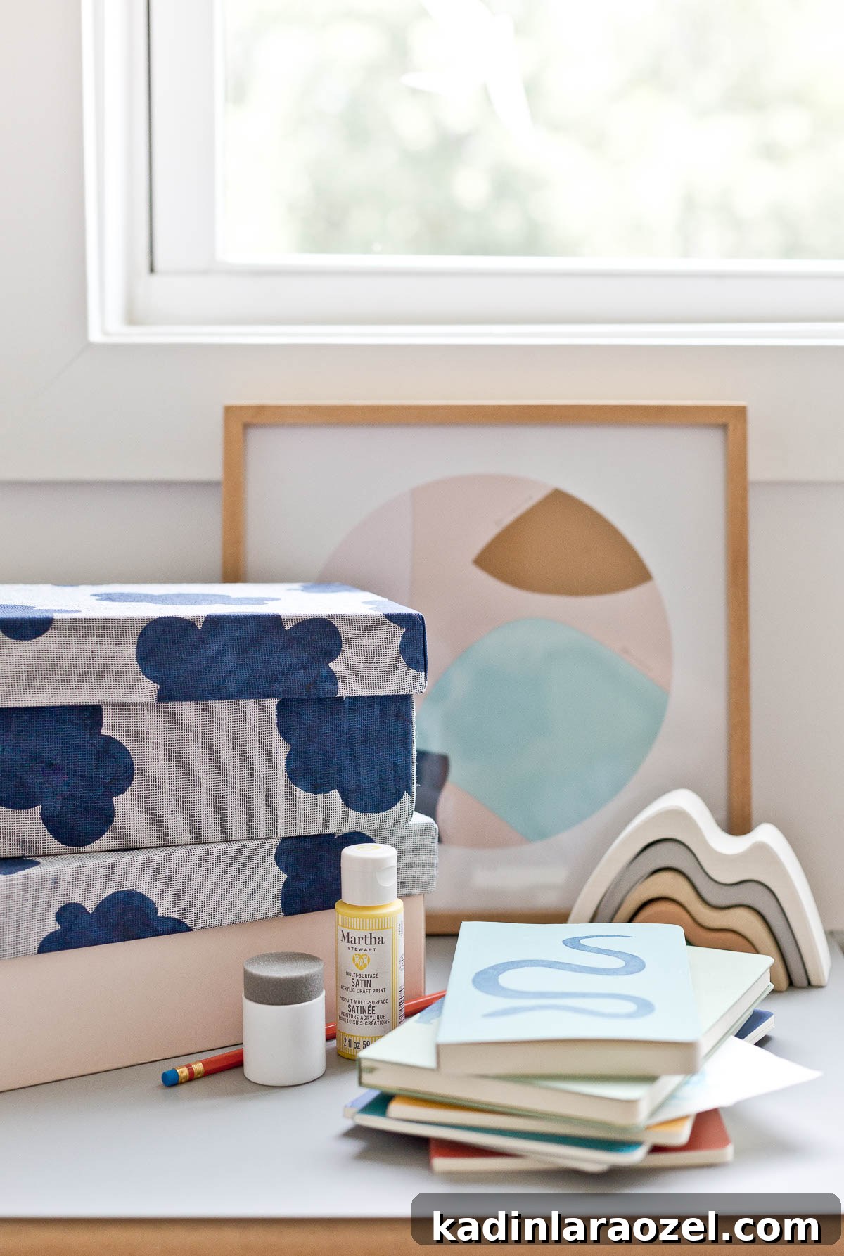 3 Stylish Back-to-School DIY Projects That Impress 3 Shelf in kid's room with neutral colors and simple fabric covered storage boxes and notebooks