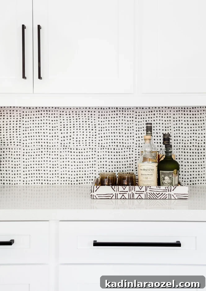16 Stylish Temporary and Permanent Wallpapers to Transform Your Home 7 Black and white wallpaper pattern as backsplash in kitchen