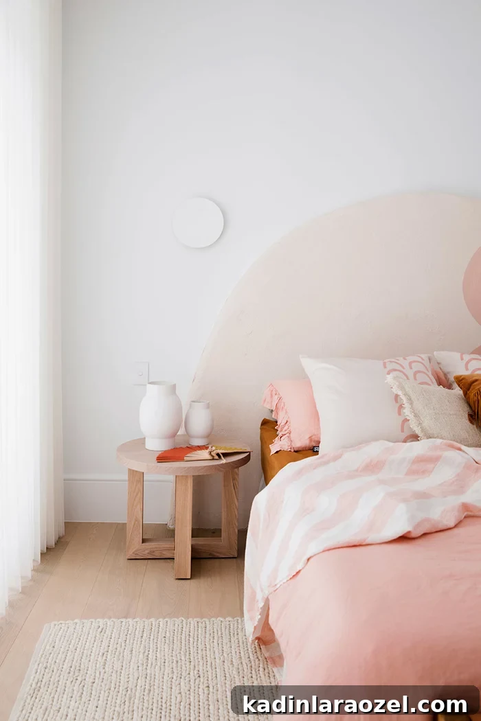 This oversized, arched headboard from Three Birds Renovations is perfection. Maybe I’m crazy, but wouldn't this make an amazing upholstered headboard DIY?! I mean, I did just buy a jigsaw, so I'm kinda obligated to at least try it, right?! #arch #designtrend #interiors #organicmodern #bedroom #pink #headboard #statementheadboard