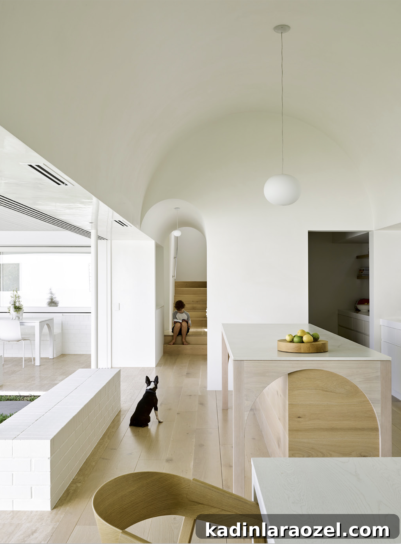Arched doorway, arched ceiling, arched island, oh my! This space from Hogg and Lamb really embraces the arched trend in several places...there's even an arch detail over at the dining room table.  #arch #designtrend #interiors #organicmodern #kitchen #whitekitchen #minimalkitchen #minimalinterior