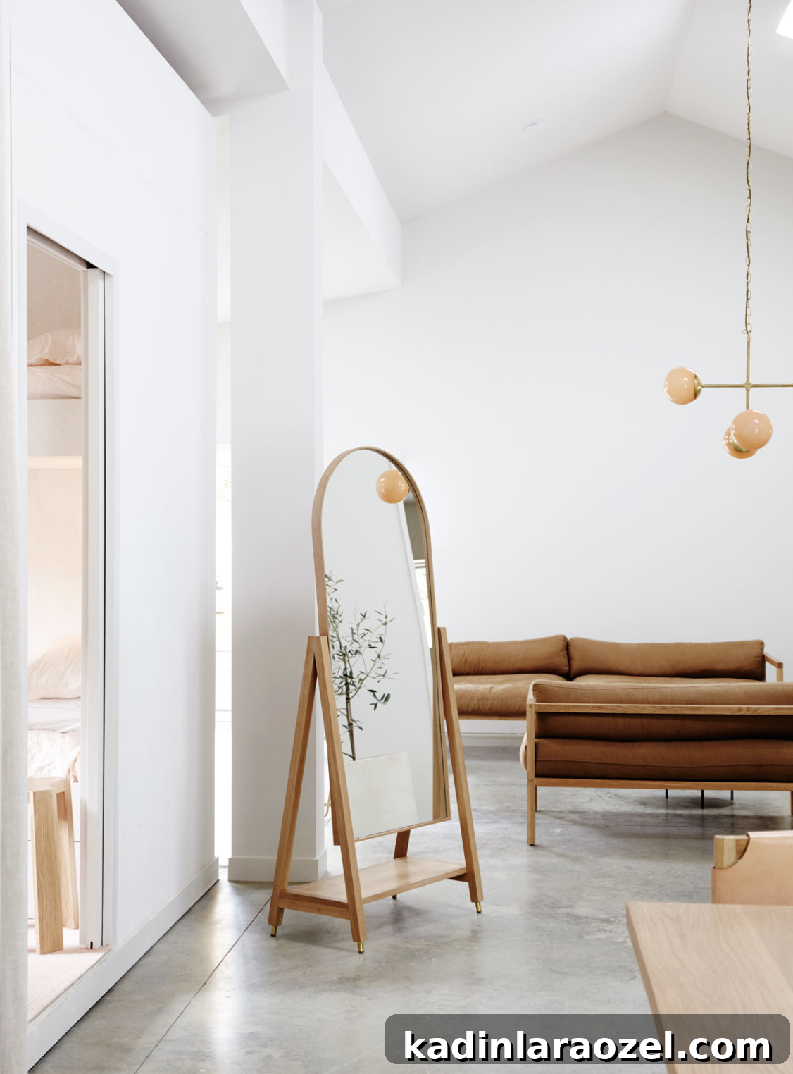This free-standing arch mirror from Douglas and Bec is so good. #arch #designtrend #interiors #organicmodern #livingroom #archmirror 