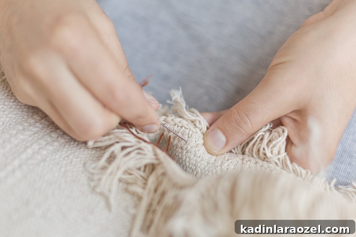 A detail photo of creating an invisible stitch to sew up the final side of the DIY cat bed.