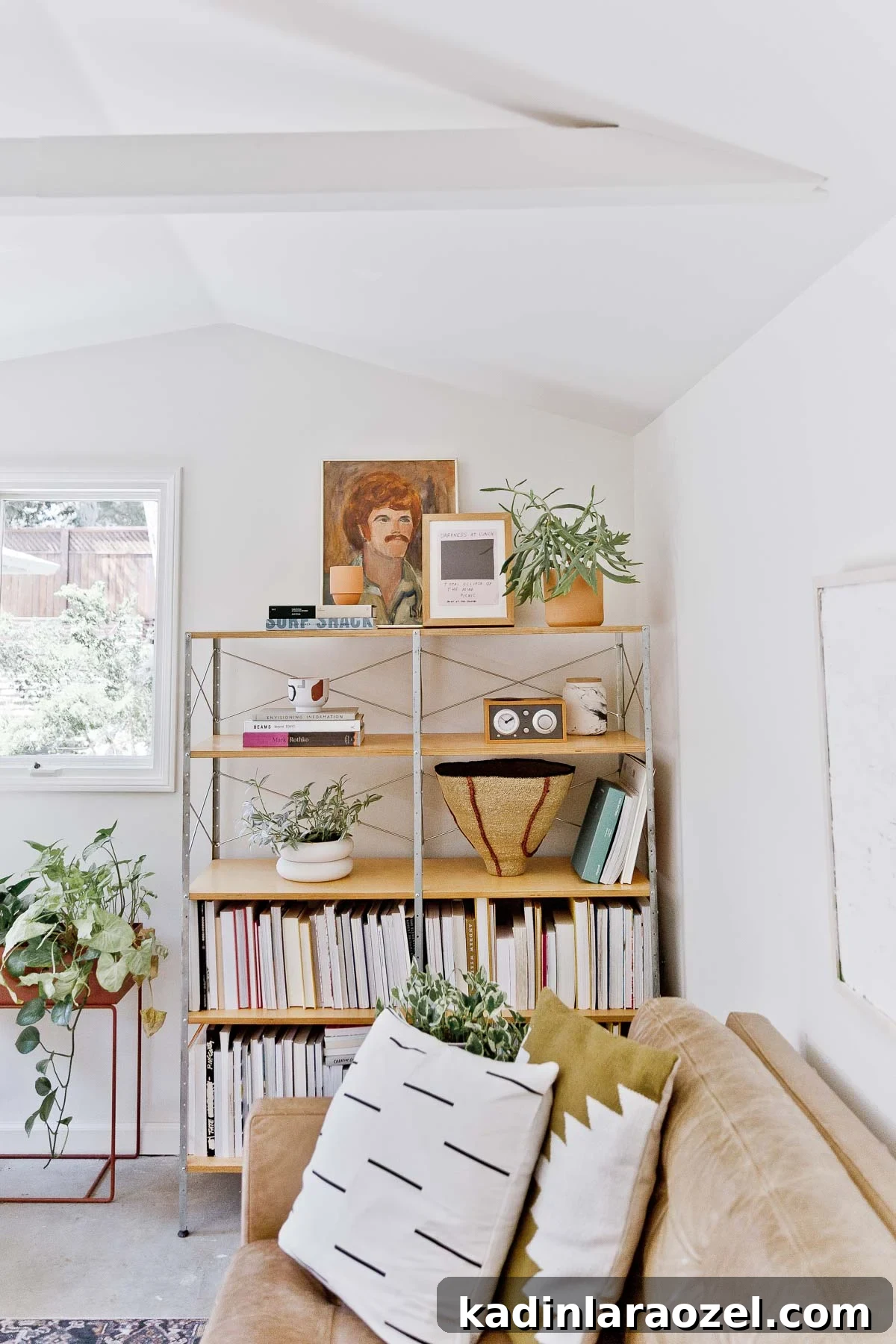 book shelves styled with books on the bottom shelves and decorative items on top shelves