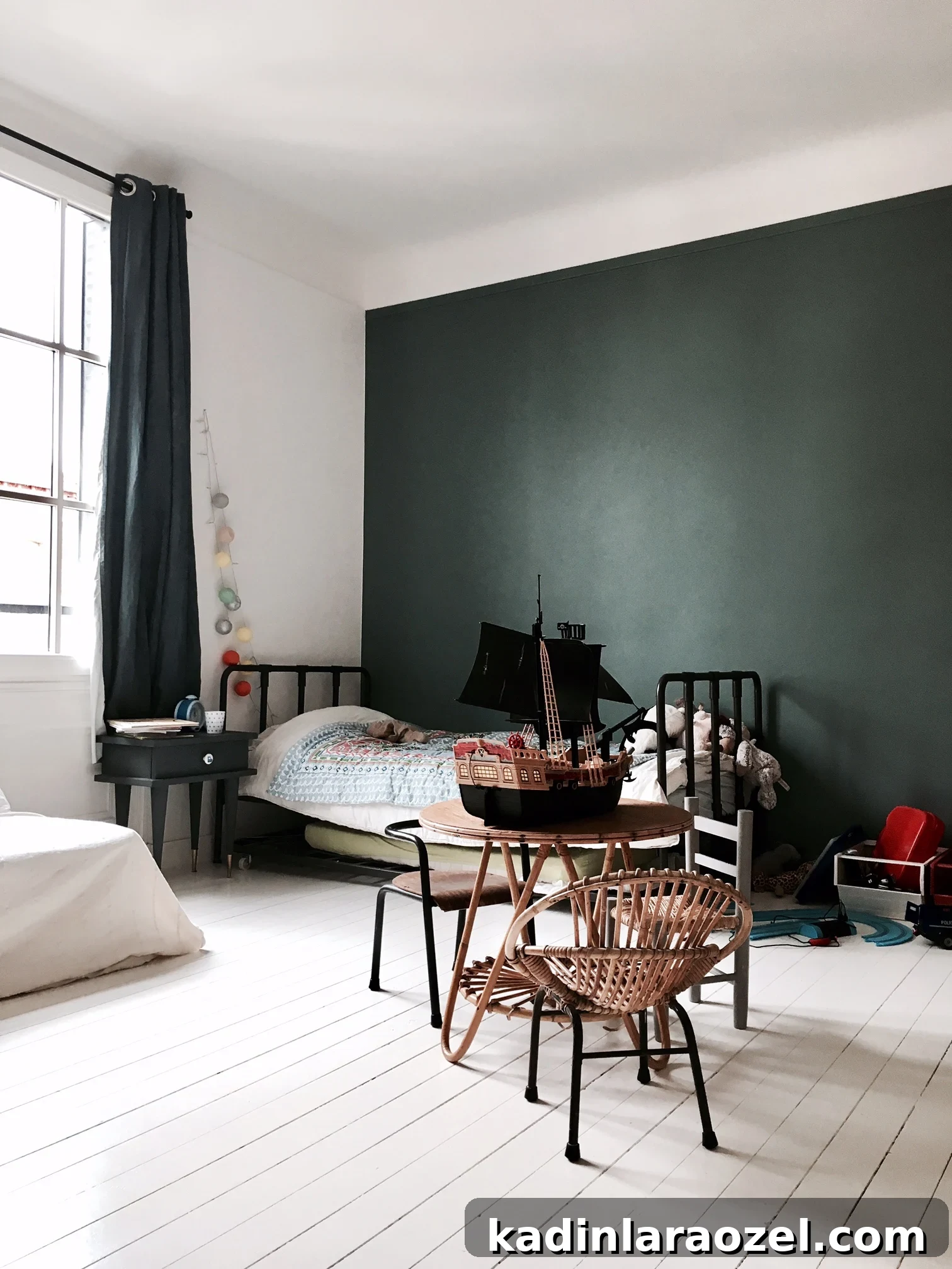 Moody Green Interiors: 12 Stylish Ways to Use the Color 12 A green accent wall in a cute, modern kid's room.