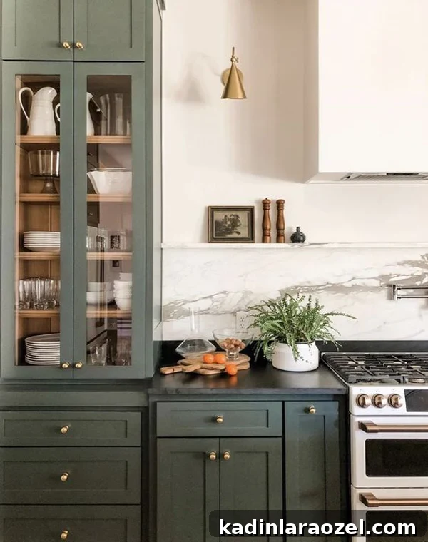 Moody Green Interiors: 12 Stylish Ways to Use the Color 5 Green cabinets and brass hardware with soapstone counters.