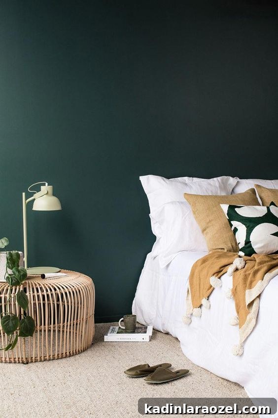 Moody Green Interiors: 12 Stylish Ways to Use the Color 6 A moody green (almost forest green meets teal) color bedroom with white bedding.