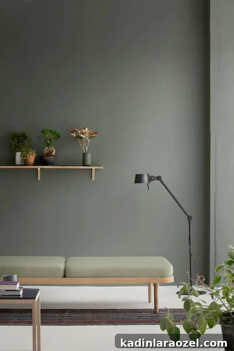 Moody Green Interiors: 12 Stylish Ways to Use the Color 9 A minimal modern moody green interior.