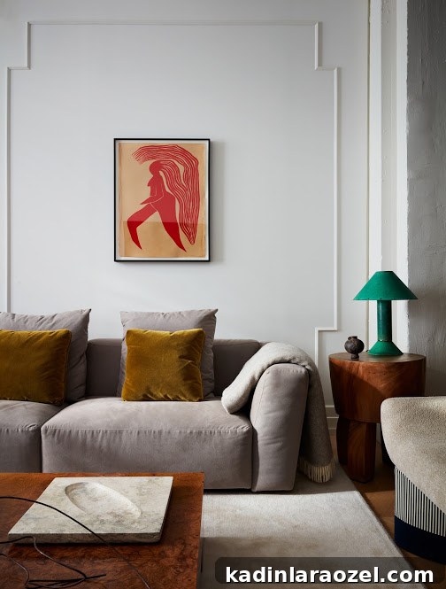living room in new york apartment with light grey poufy sofa